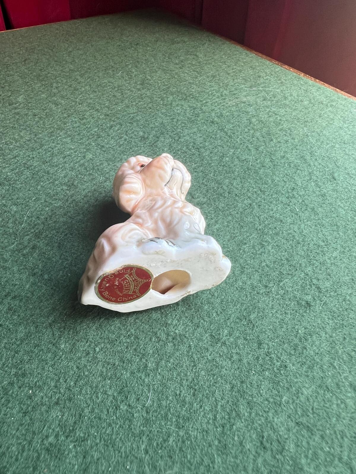 Vintage sad poodle puppy figurine. Bone China Dog ornament. Original sticker.