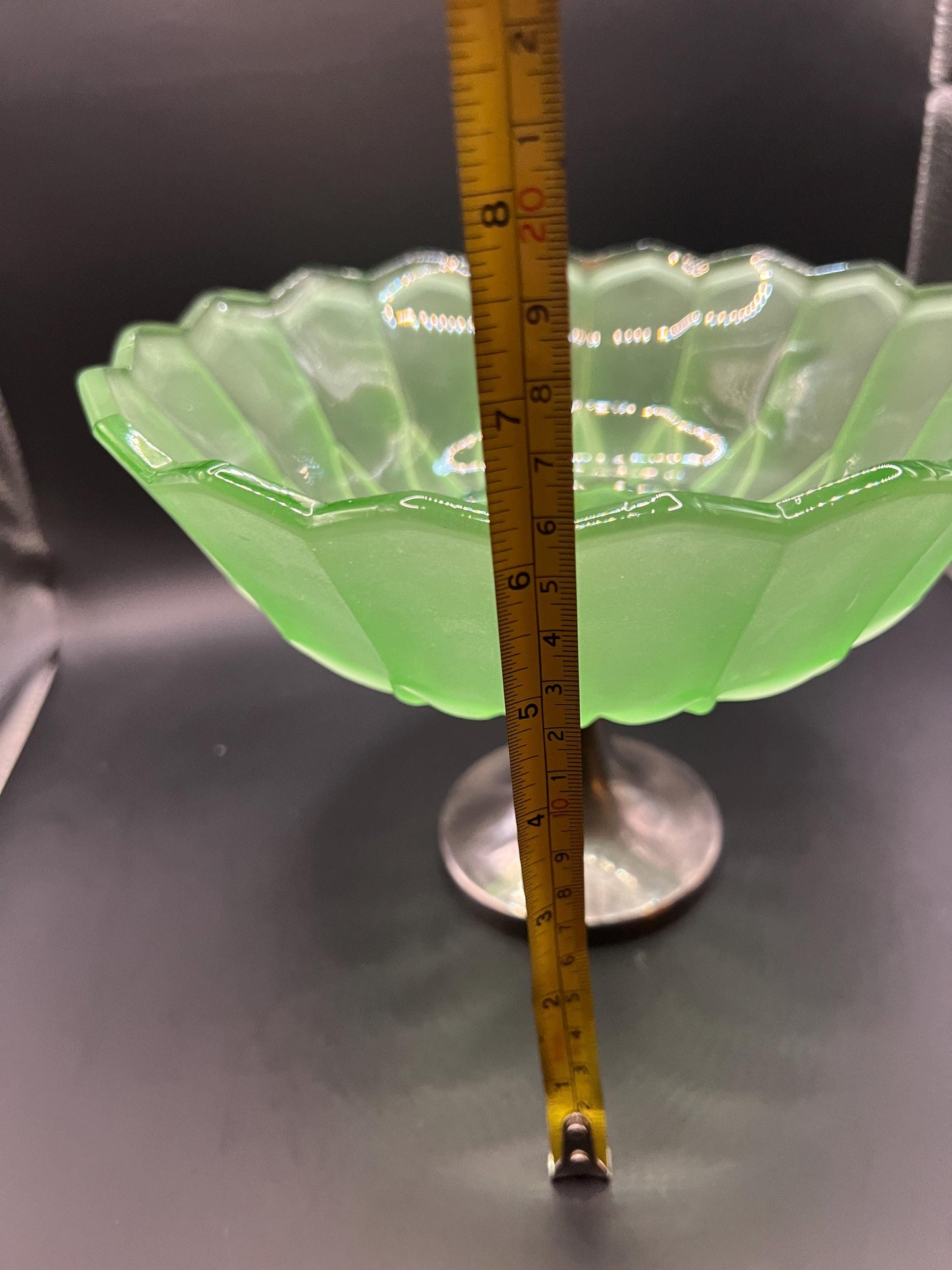 1930s green stretch glass pedestal bowl on silver tone base.