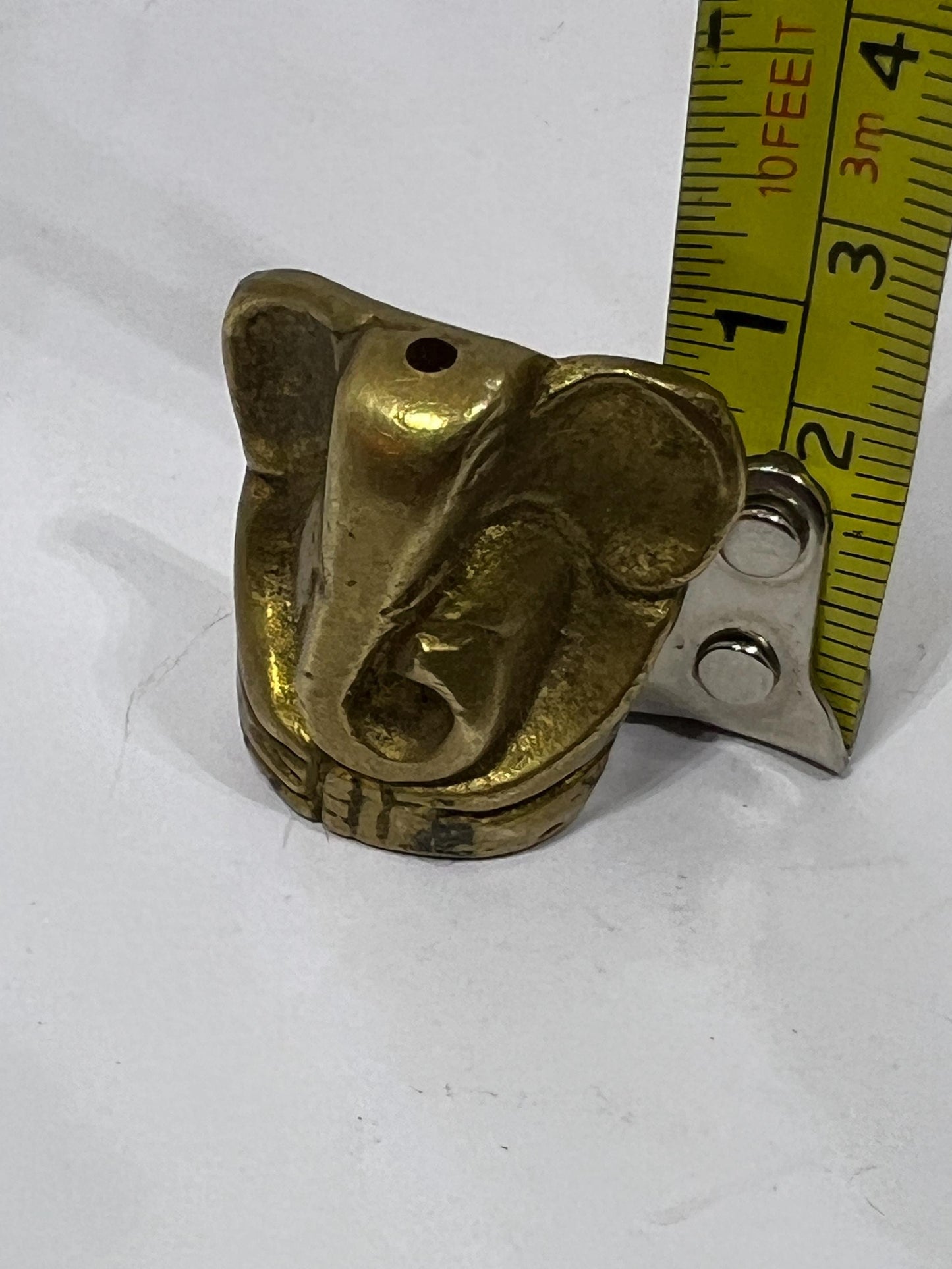 Tiny solid brass Ganesh elephant incense stick holder.