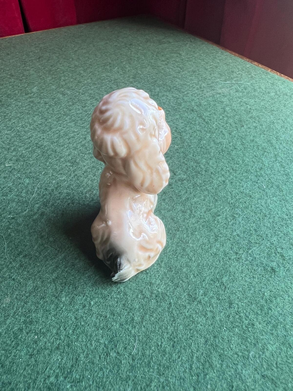 Vintage sad poodle puppy figurine. Bone China Dog ornament. Original sticker.