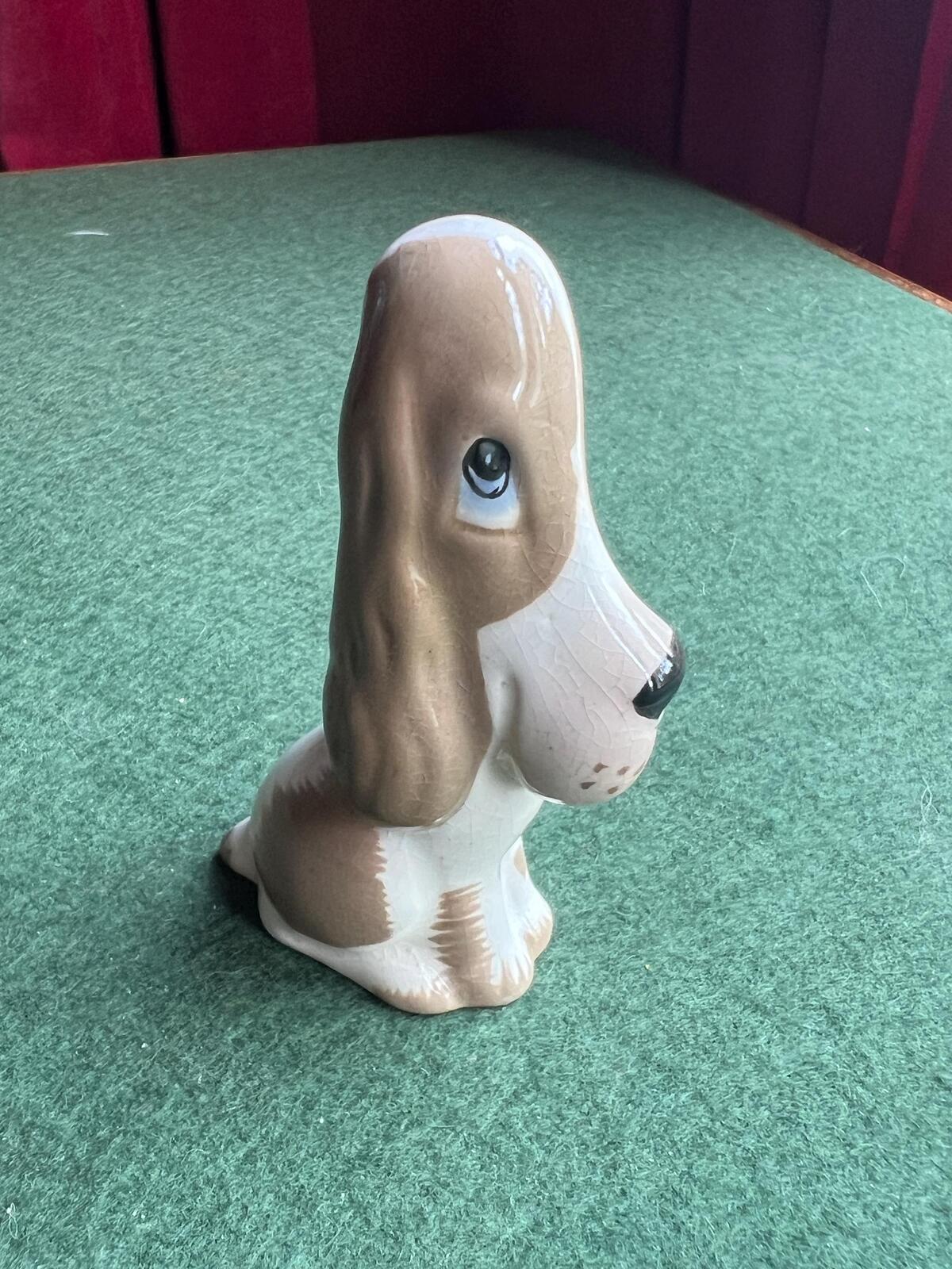Vintage ceramic sad hound dog figurine. Stamped Szeiler
