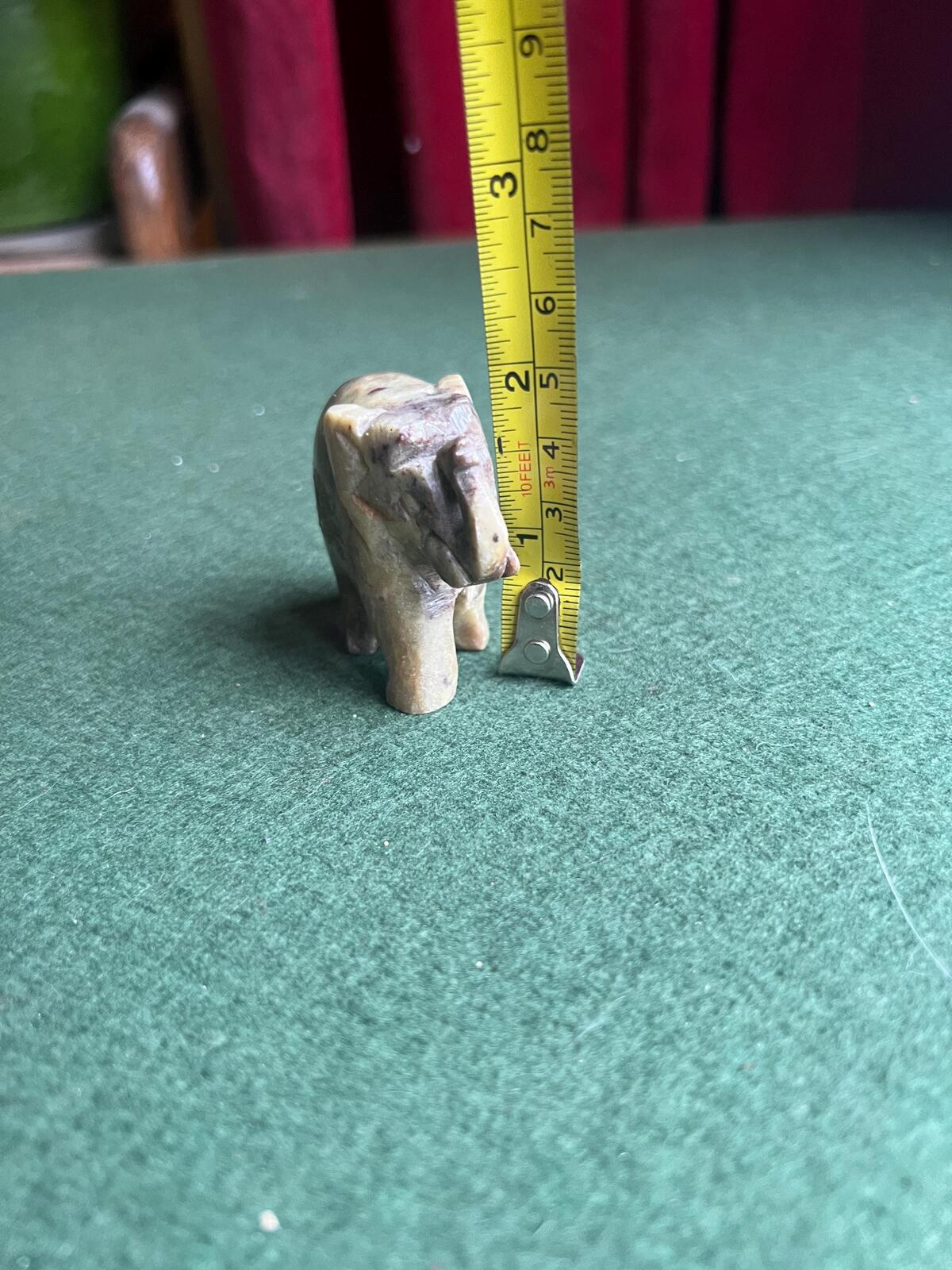 Stone elephant figure. Miniature marble hand carved lucky elephant.