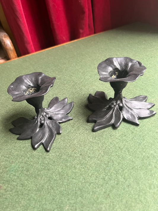 Pair of metal flower shaped candle holders Black metal trumpet flower with leaves