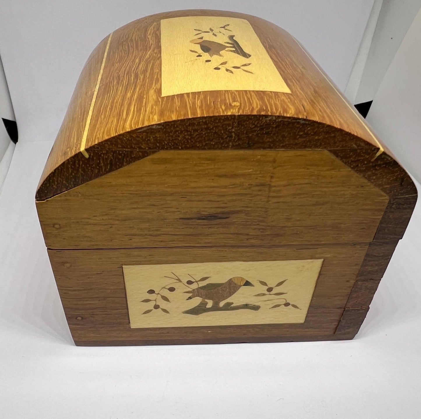 Wooden lidded secret lock treasure box. Inlaid marquetry bird themed domed jewellery box.