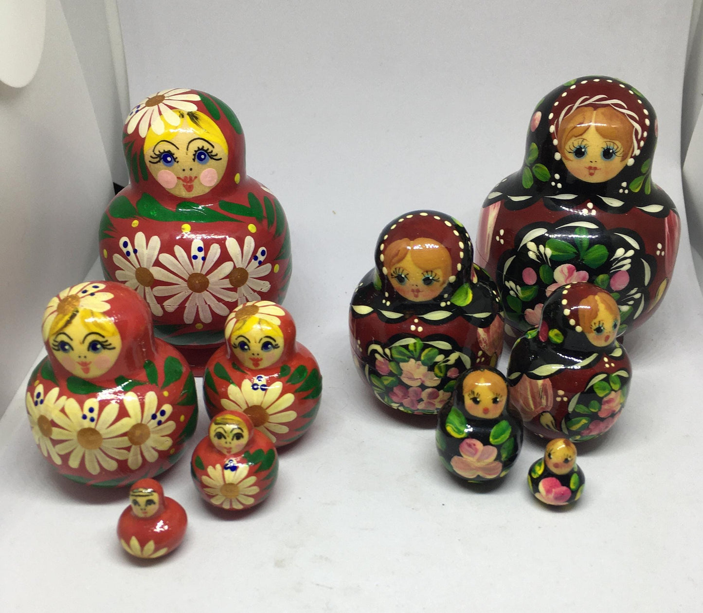 Matryoshka nesting dolls with 4 smaller dolls. Beautifully detailed floral designs. 1 available.