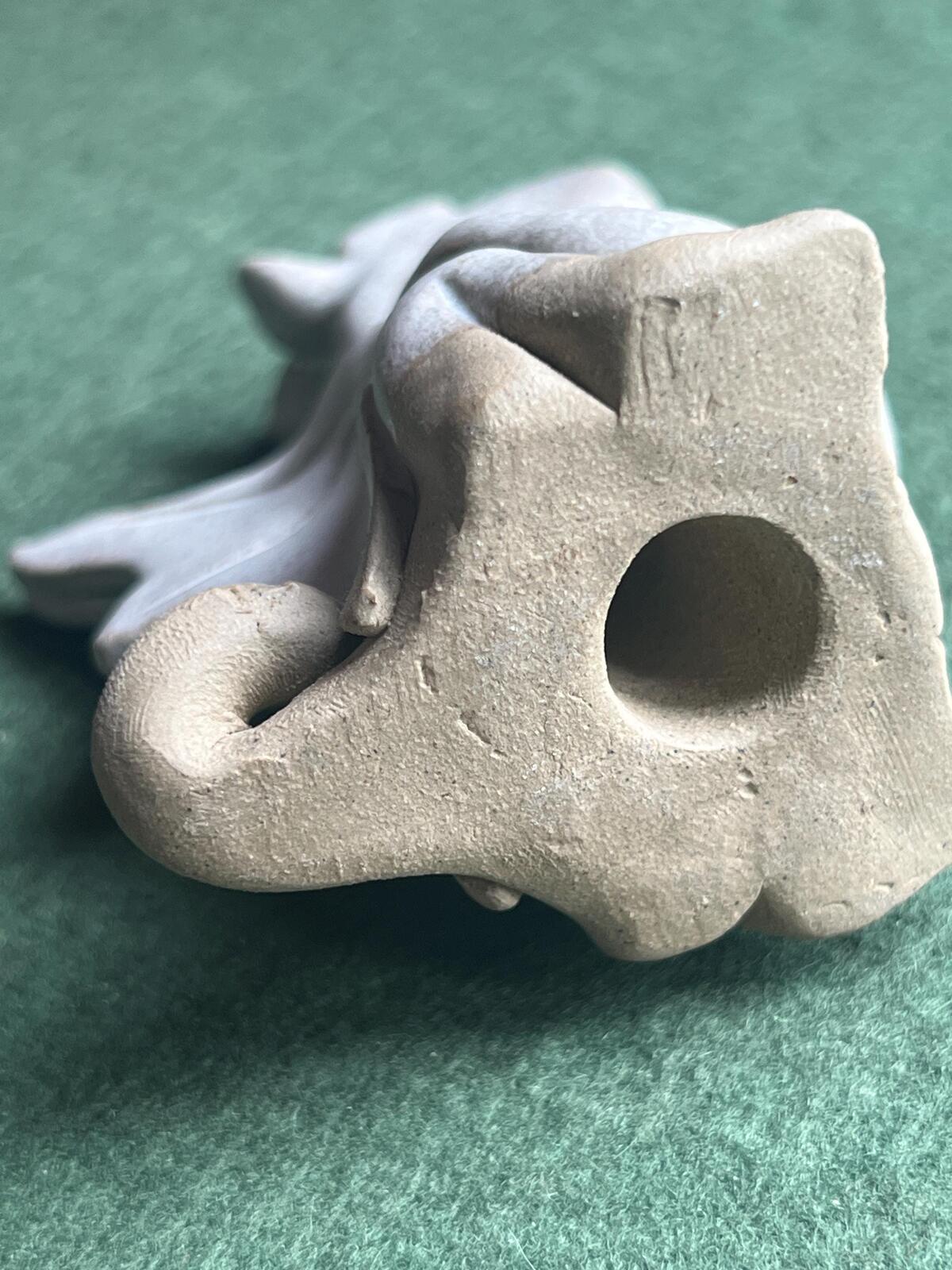 Hand built pottery dragon figurine. Grey clay ready to be painted dragon.